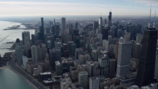 AX0165_0057 - 4K aerial stock footage of approaching and flying over waterfront skyscrapers from Lake Michigan in Downtown Chicago, Illinois