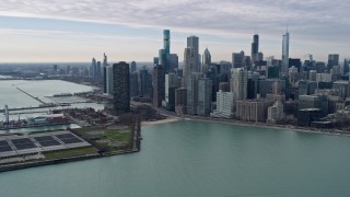 AX0165_0068 - 4K aerial stock footage of skyscrapers and Navy Pier in Downtown Chicago, Illinois