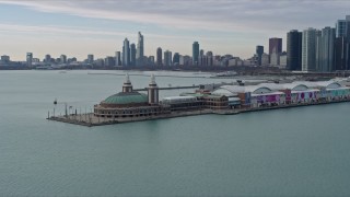 AX0165_0069 - 4K aerial stock footage of circling around Navy Pier to reveal Downtown Chicago skyline, Illinois