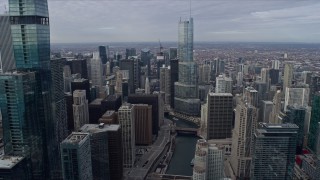 AX0165_0073 - 4K aerial stock footage of following the Chicago River through Downtown Chicago, Illinois