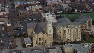 AX0166_0002 - 4K aerial stock footage of a church and prep school in West Side Chicago, Illinois