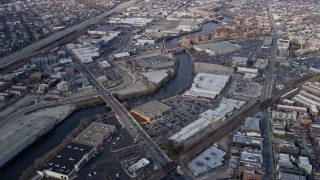 AX0166_0008 - 4K aerial stock footage of a shopping center by the Chicago River in North Side Chicago, Illinois