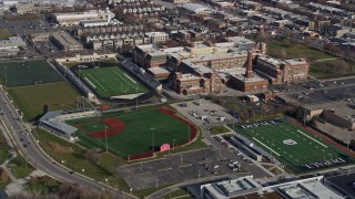 AX0166_0010 - 4K stock footage aerial video of a high school and sports fields in North Side Chicago, Illinois