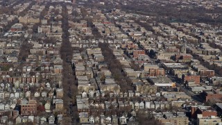 AX0166_0011 - 4K aerial stock footage of flying past urban neighborhoods in North Side Chicago, Illinois
