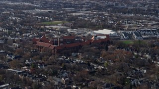 AX0166_0012 - 4K aerial stock footage of flying past a high school in Northwest Side Chicago, Illinois