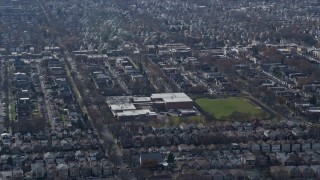 AX0166_0014 - 4K aerial stock footage of flying past a military high school in Northwest Side Chicago, Illinois