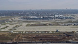 AX0166_0023 - 4K aerial stock footage of flying away from O'Hare International Airport, Chicago, Illinois