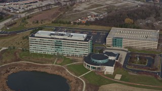 AX0166_0030 - 4K aerial stock footage of approaching an office complex in Deer Park, Illinois