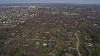 AX0166_0031 - 4K aerial stock footage of flying over a quiet suburban neighborhood in Kildeer, Illinois