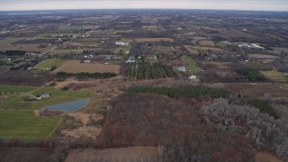 AX0166_0056 - 4K aerial stock footage of flying over rural homes, farms and fields in Franksville, Wisconsin