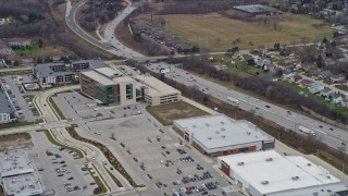 AX0166_0064 - 4K aerial stock footage of flying by a medical center in Greenfield, Wisconsin