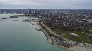 AX0167_0009 - 4K aerial stock footage of approaching skyscrapers in downtown and waterfront park, Milwaukee, Wisconsin