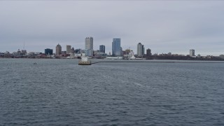 AX0167_0012 - 4K aerial stock footage of approaching the city's skyline and the lighthouse, Milwaukee, Wisconsin
