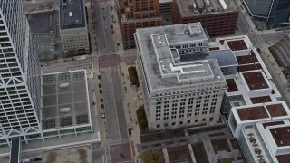 AX0167_0015 - 4K aerial stock footage flying by and away from a downtown office building, Milwaukee, Wisconsin