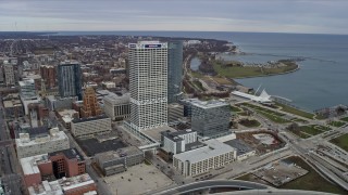 AX0167_0019 - 4K aerial stock footage orbit tall skyscrapers and reveal museum in downtown, Milwaukee, Wisconsin