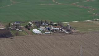 AX0167_0043 - 4K aerial stock footage of silos at a farm in Franksville, Wisconsin
