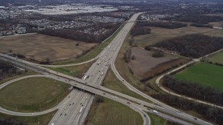 AX0167_0056 - 4K aerial stock footage of following the Tri-State Tollway freeway through Waukegan, Illinois