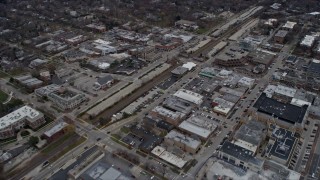 AX0167_0064 - 4K aerial stock footage of flying over shops in the center of Highland Park, Illinois
