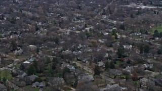 AX0167_0066 - 4K aerial stock footage of a quiet suburban neighborhood in Glencoe, Illinois