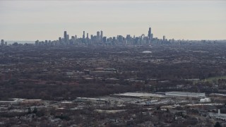 AX0167_0074 - 4K aerial stock footage of the Downtown Chicago skyline seen from Northwest Side Chicago, Illinois