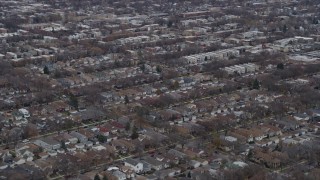 AX0167_0075 - 4K aerial stock footage of passing by urban neighborhoods in Northwest Side Chicago, Illinois
