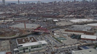 AX0167_0081 - 4K aerial stock footage of flying by the Damen Avenue Bridge in North Side Chicago skyline, Illinois