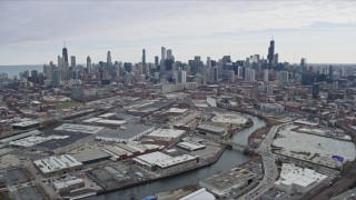 AX0167_0083 - 4K aerial stock footage of following the river toward the Downtown Chicago skyline, Chicago, Illinois