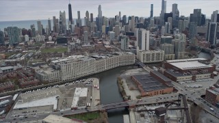 AX0167_0084 - 4K aerial stock footage of riverfront office buildings near the Chicago Tribune building in Chicago, Illinois