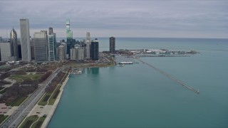 AX0167_0093 - 4K aerial stock footage of following Lake Shore Drive toward skyscrapers and Navy Pier, Downtown Chicago, Illinois