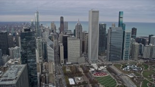 AX0167_0095 - 4K aerial stock footage of tilting from Grant Park to nearby skyscrapers, Downtown Chicago, Illinois