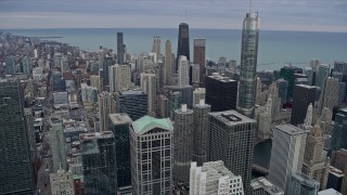 AX0167_0101 - 4K aerial stock footage tilt from a view of skyscrapers to reveal the Chicago River, Downtown Chicago, Illinois