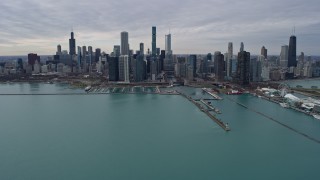 AX0167_0107 - 4K stock footage aerial video of the city's waterfront skyline and Grant Park, seen from Lake Michigan, Downtown Chicago, Illinois