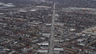 AX0168_0007 - 4K aerial stock footage of following Archer Avenue past urban neighborhoods on the Southwest Side Chicago, Illinois