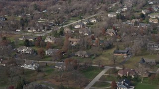 AX0168_0024 - 4K aerial stock footage of upscale homes in a quiet neighborhood in Lemont, Illinois