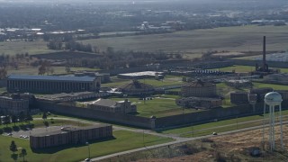 AX0168_0034 - 4K aerial stock footage orbit the Stateville Correctional Center prison in Crest Hill, Illinois