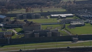 AX0168_0035 - 4K aerial stock footage of buildings at the Stateville Correctional Center prison in Crest Hill, Illinois
