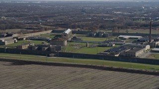 AX0168_0036 - 4K aerial stock footage of flying by the Stateville Correctional Center prison in Crest Hill, Illinois