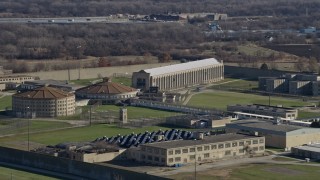 AX0168_0037 - 4K aerial stock footage of zooming in on buildings at the Stateville Correctional Center prison in Crest Hill, Illinois
