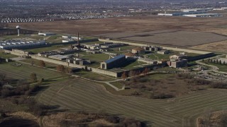 AX0168_0041 - 4K aerial stock footage of circling around the Stateville Correctional Center prison in Crest Hill, Illinois