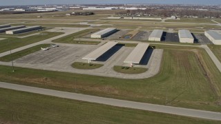 AX0168_0043 - 4K aerial stock footage of approaching hangars at the Lewis University Airport in Romeoville, Illinois
