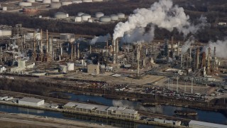 AX0169_0002 - 4K aerial stock footage of passing by an oil refinery in Romeoville, Illinois