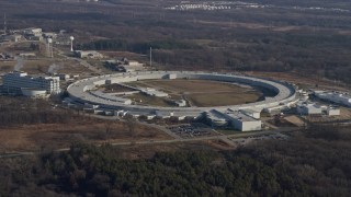 AX0169_0005 - 4K aerial stock footage of the Advanced Photon Source at the Argonne National Laboratory in Lemont, Illinois