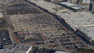 AX0169_0012 - 4K aerial stock footage of flying over a parking lot and approach shopping mall, Hodgkins, Illinois
