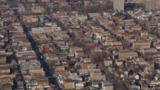 AX0169_0019 - 4K aerial stock footage of flying past an urban neighborhood in West Side Chicago, Illinois