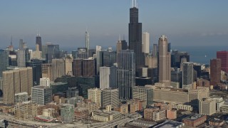 AX0169_0023 - 4K aerial stock footage of approaching and flying by Willis Tower and Downtown Chicago skyscrapers, Illinois