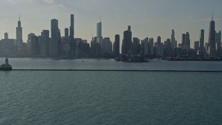 AX0169_0035 - 4K aerial stock footage of the city's downtown skyline and Navy Pier, seen from lighthouse, Downtown Chicago, Illinois