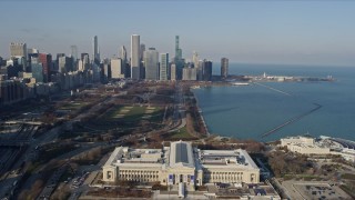 AX0169_0042 - 4K aerial stock footage fly over Field Museum to approach Grant Park and skyscrapers, Downtown Chicago, Illinois