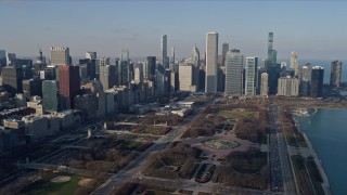 AX0169_0043 - 4K aerial stock footage fly over Grant Park toward skyscrapers, Downtown Chicago, Illinois