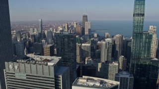 AX0169_0045 - 4K aerial stock footage fly over skyscrapers by Grant Park to approach John Hancock Center, Downtown Chicago, Illinois