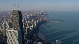 AX0169_0046 - 4K aerial stock footage fly past John Hancock Center to reveal and approach Lincoln Park, Downtown Chicago, Illinois